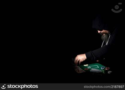 poker player in the darkness with copy space.. poker player in the darkness with copy space
