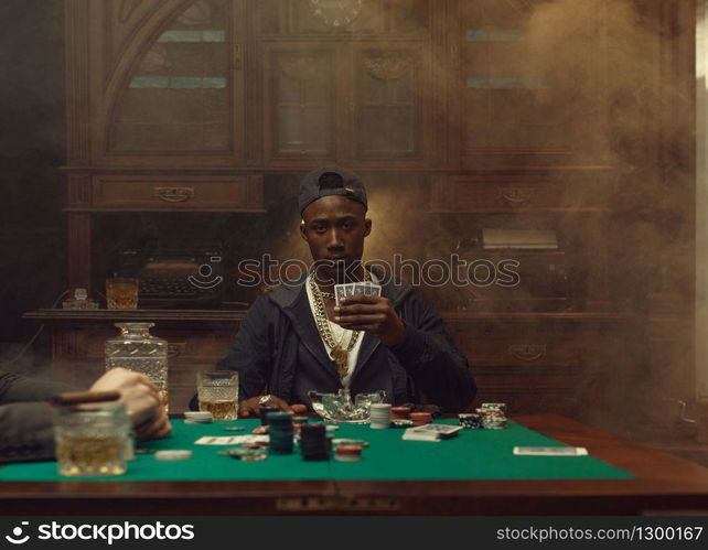 Poker player plays in casino. Games of chance addiction. Man leisures in gambling house, gaming table with green cloth. Poker player plays in casino