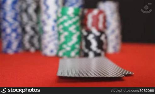 Poker player showing good card combination, pair of aces in slow motion