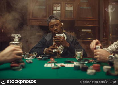 Poker players at gaming table with bets, casino. Games of chance addiction, risk, gambling house. Men leisures with whiskey and cigars