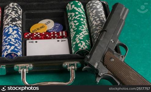 Poker set with a gun. The concept of gambling and entertainment. Casino and poker. gambling poker, closeup