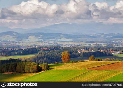 Poland autumn hills. Sunny October day in Malopolska mountain village. Fall in Poland
