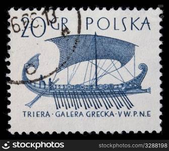 POLAND, circa 1960 - trireme, ancient Greek warship with three rows of oars, on a vintage canceled post stamp, blue drawing on white