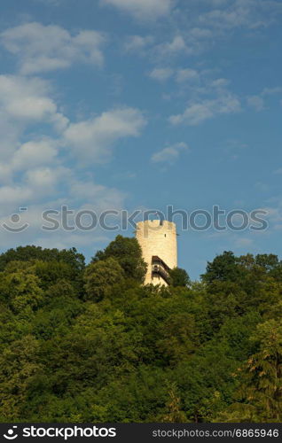 Poland, view of a defensive tower built on a hill in the fourteenth century against the blue sky in Kazimierz Dolny (Kazimierz on the Vistula). Editorial. Vertical view.