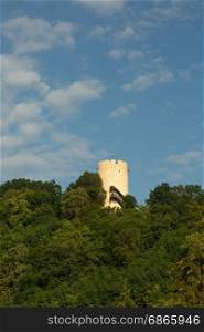 Poland, view of a defensive tower built on a hill in the fourteenth century against the blue sky in Kazimierz Dolny (Kazimierz on the Vistula). Editorial. Vertical view.