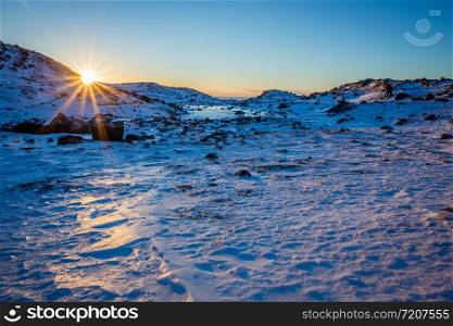 Polar arctic greenlandic sunset over the snow mountains, Nuuk, Greenland