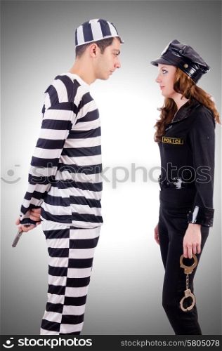 Police and prison inmate on white