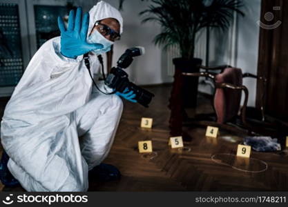 Police Forensic Detective Photographing Crime Scene, Collecting Evidence