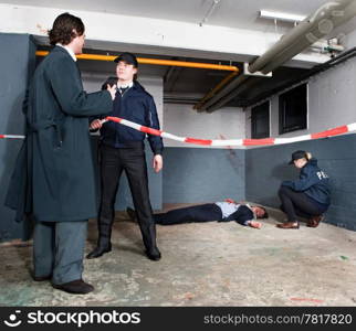 Police inspector identifying himself to a policeman when arriving at a crime scene