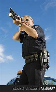 Police Officer Aiming Shotgun