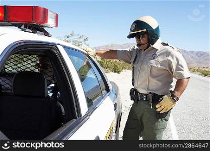 Police Officer Arresting a Man