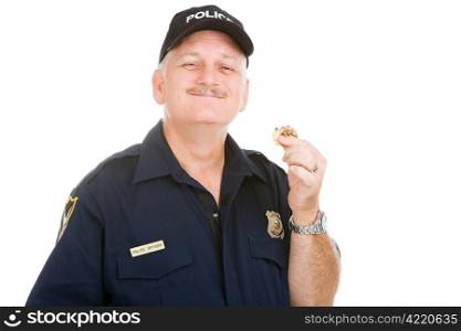 Police officer enjoys finishing off a donut. Isolated on white.