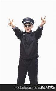 Police Officer Giving Peace Sign, Studio Shot