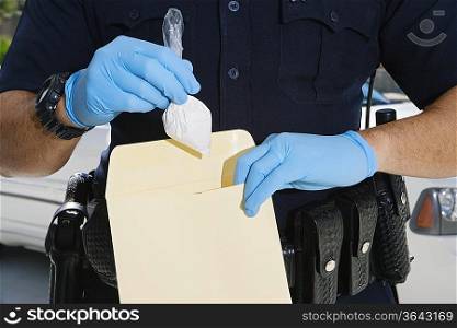 Police Officer Putting Cocaine in Evidence Envelope