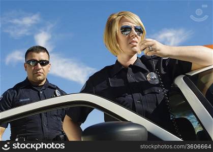 Police Officers Using Two-Way Radio