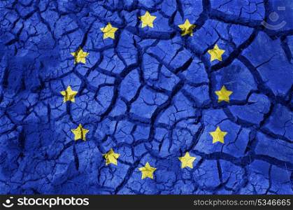 policy, crisis and national security concept - flag of europe on cracked ground background. flag of europe on cracked ground background