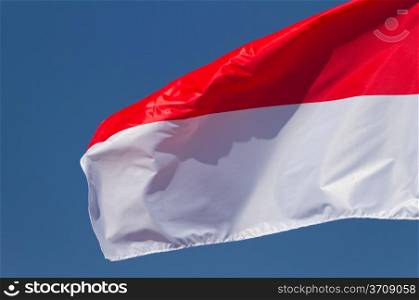 Polish flag on a blue sky