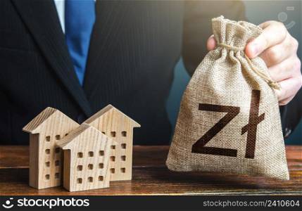 Polish zloty money bags and residential buildings figures. Taxes. Bank offer of mortgage loan. Rental business. Sale of housing. Municipal budget. Investments in real estate and construction industry.