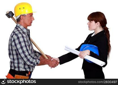 Polite architect and builder greeting each other
