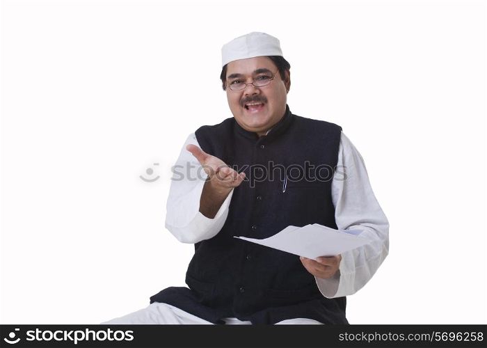 Politician in traditional clothes gesturing