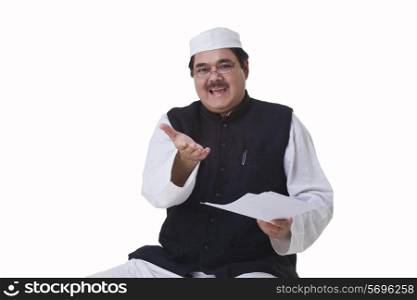 Politician in traditional clothes gesturing