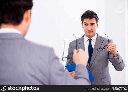 Politician planning speach in front of mirror