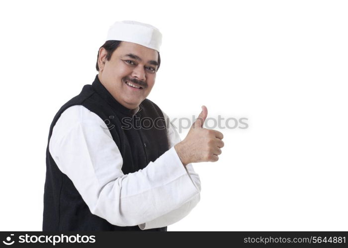 Politician showing thumbs up sign