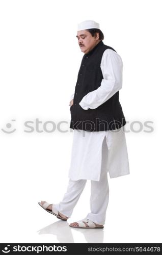 Politician walking with eyes closed over white background