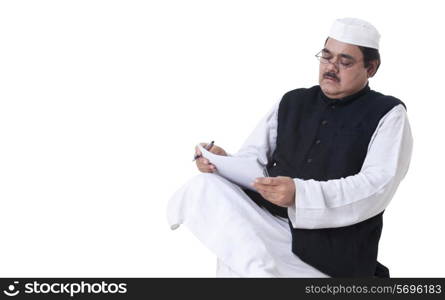 Politician writing on documents