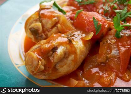 "Pollo alla Cacciatora - means "hunter" in Italian. In cuisine, alla cacciatora refers to a meal prepared "hunter-style" with tomatoes, onions, herbs, often bell pepper, and sometimes wine."