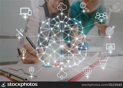 Polygonal brain shape of an artificial intelligence with various icon of smart city Internet of Things Technology over Business documents with laptop on the workplace, AI and business IOT concept
