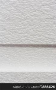 Polystyrene insulation boards background with copyspace, vertical side shot