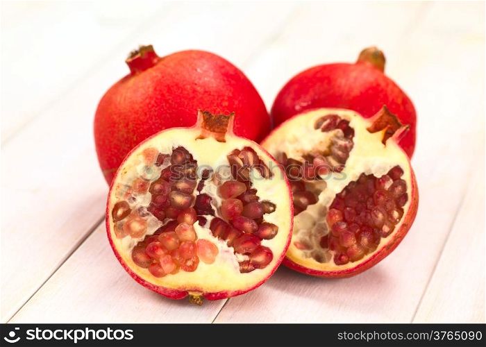 Pomegranate fruits (lat. Punica granatum) (Selective Focus, Focus on the seeds in the front)
