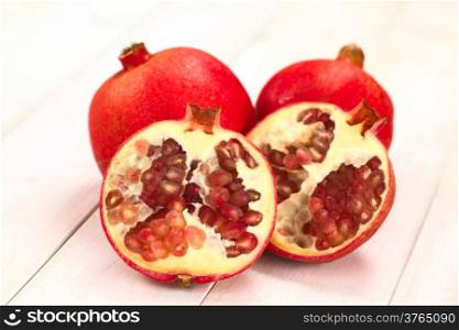 Pomegranate fruits (lat. Punica granatum) (Selective Focus, Focus on the seeds in the front)