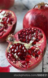 Pomegranate fruits on a white marble background