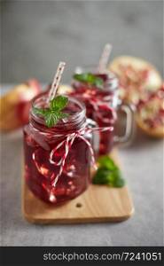 Pomegranate juice in jar with handle.