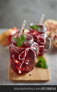 Pomegranate juice in jar with handle.  