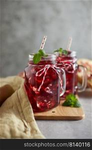 Pomegranate juice in jar with handle.  