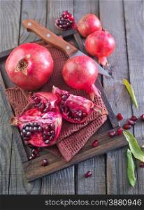 pomegranate on napkin and on a table