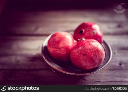 Pomegranate on wooden background