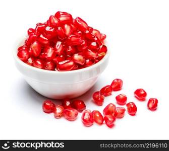 Pomegranate seeds in ceramic bowl close-up macro studio shot. Pomegranate seeds in ceramic bowl close-up