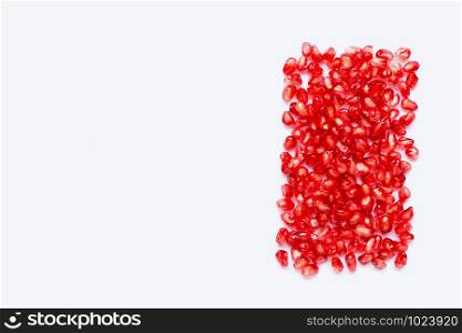 pomegranate seeds isolated on white background. Copy space