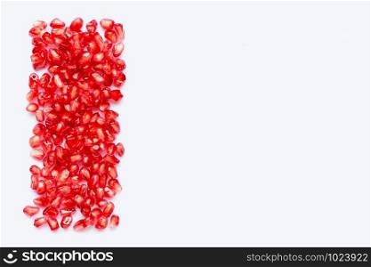 pomegranate seeds isolated on white background. Copy space