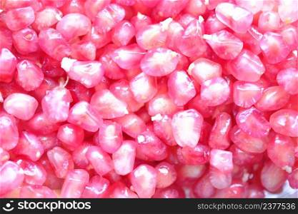Pomegranate seeds many bright pink beautiful, sweet delicious