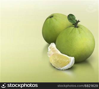 Pomelo on green solid background with text