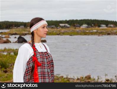 Pomorian girl in national dress is waiting for the return of the groom from the voyage