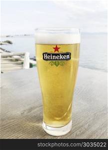 Pomorie, Bulgaria - May 19, 2018: Heineken Lager Beer produced by the Dutch brewing company. Heineken is well known for its signature green bottle and red star.