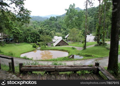 Pond and houses in the national park Pongduet in Northern Thailand