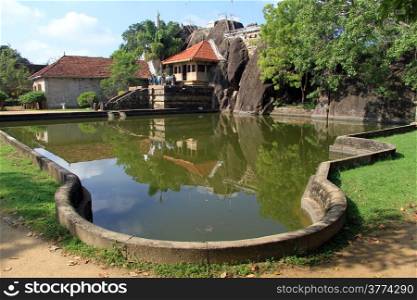 Pond and Isurumuniya rock temple in Anuradhapura, Sri Lanka