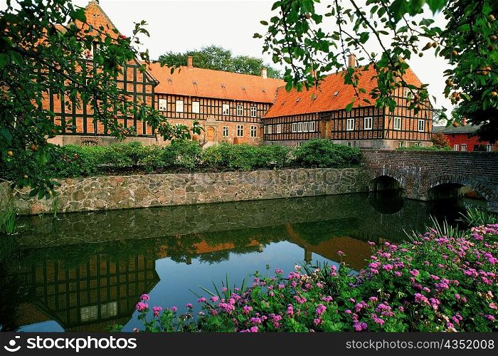 Pond in front of a building, Funen County, Denmark